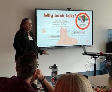 Woman making a presentation with a PowerPoint.